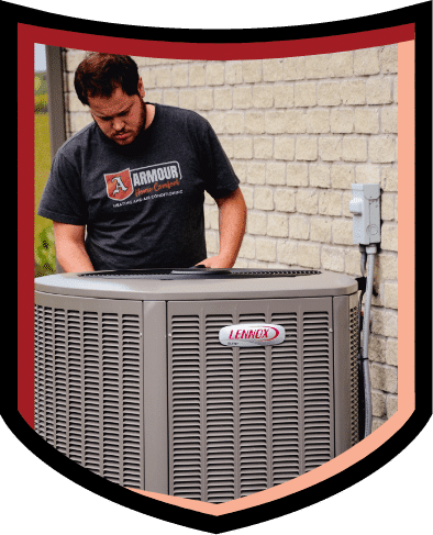Armour Home Comfort employee working on an air conditioning unit